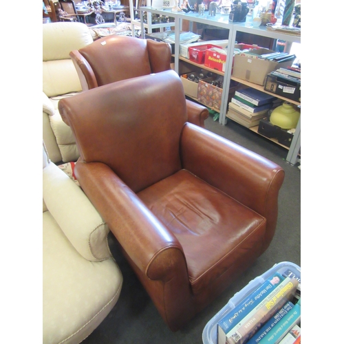 1173 - A modern tan leather deep seated armchair