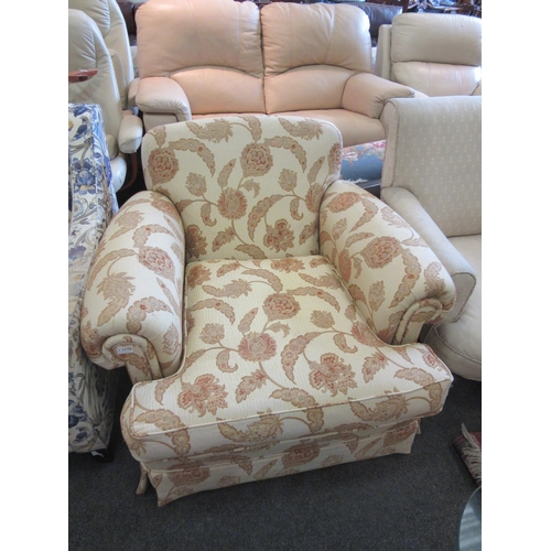 1175 - A modern deep seated floral upholstered armchair on castors