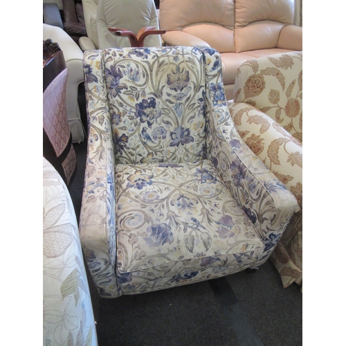 1176 - A Multiyork armchair with floral and bird upholstery, some signs of wear