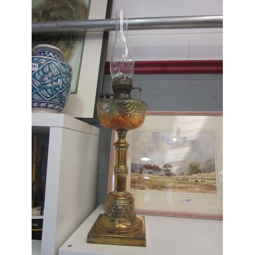 1330 - A Victorian oil lamp, brass column and amber/green glass reservoir, 72cm tall with chimney