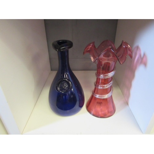 1344 - A Bristol blue pouring bottle with king seal, 22cm tall and a Victorian cranberry vase wavy rim, cle... 