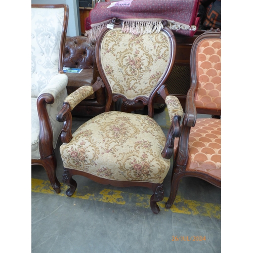 2357 - A Victorian mahogany scroll arm elbow chair