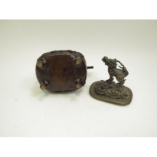 6706 - A bronze censor, the lid surmounted by a dragon dog, 13.5cm x 13cm