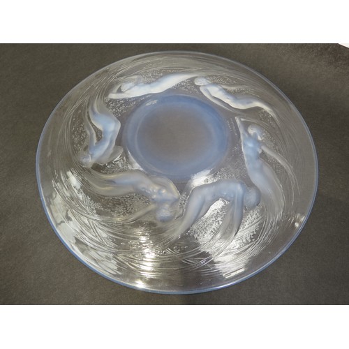 6693 - Rene Lalique an Ondines opalescent glass plate, Circa 1921, No 3003, depicting six opalescent sea sp... 