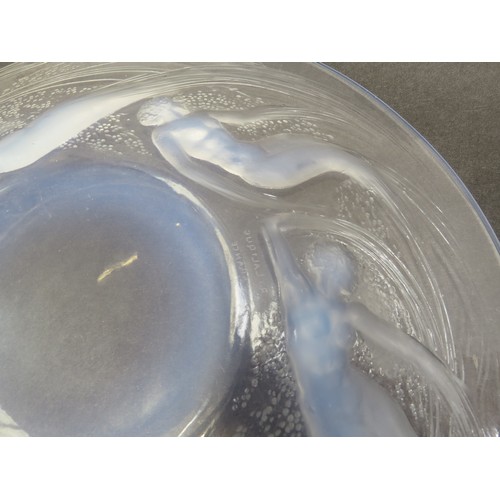 6693 - Rene Lalique an Ondines opalescent glass plate, Circa 1921, No 3003, depicting six opalescent sea sp... 