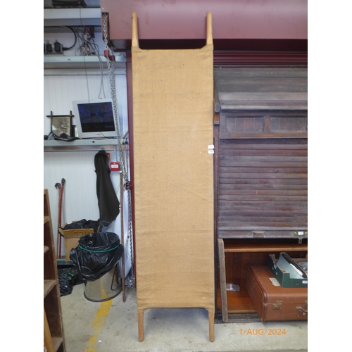 2071 - A pine and hessian stretcher/ stage prop