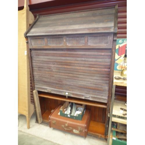 2073 - A pitch pine tambour front Gothic styled church cabinet with adjustable shelves, tambour mechanism f... 