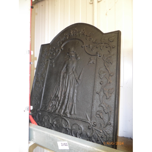 2102 - A cast iron fire back with Crinoline lady