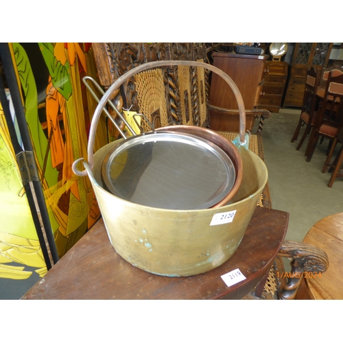 2120 - A brass preserve pan with swing handle, copper mixing bowl with brass handle and a cooper and stainl... 