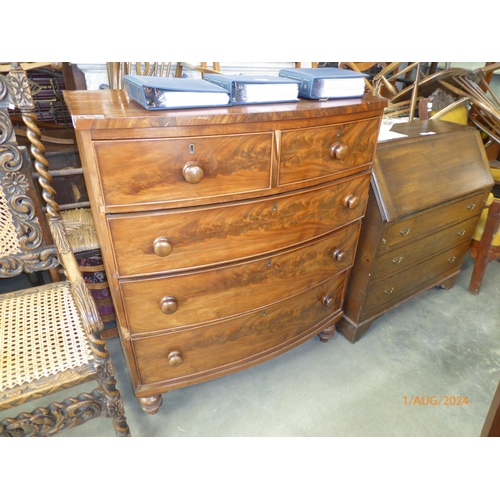 2123 - A Victorian flame mahogany bow fronted chest of two short over three long drawers, bun handles and f... 