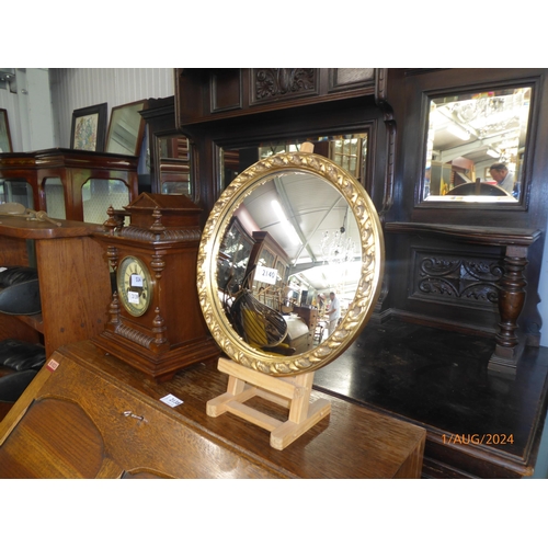 2140 - A circular gilt framed convex wall mirror