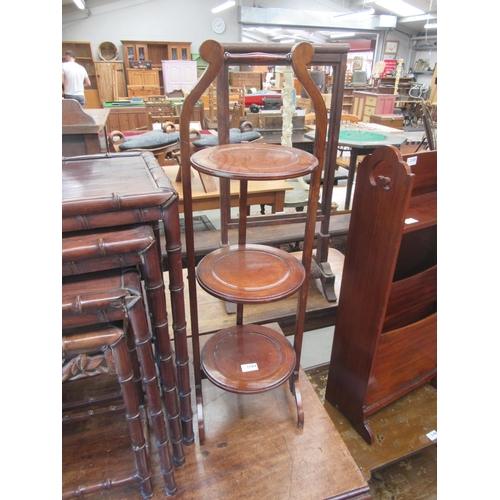 2184 - A 1930's mahogany three tier folding cake stand