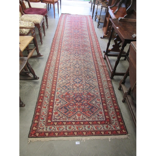 2193 - A hand woven red and blue runner rug 106 x 396cm