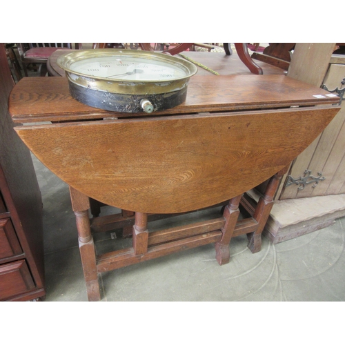 2224 - An early 20th Century oak gateleg dining table