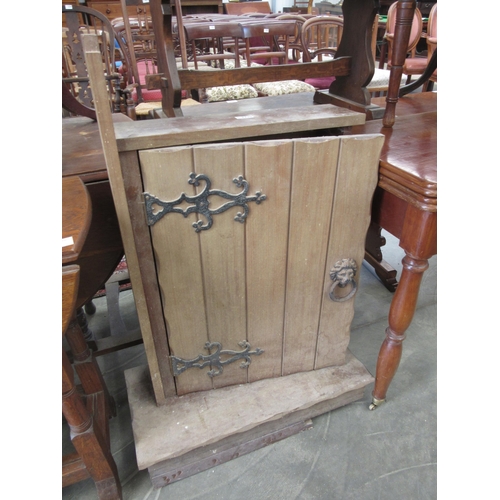 2225 - An oak cabinet with lion head handle