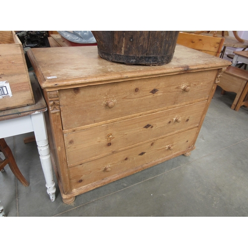 2332 - A continental pine chest of three drawers