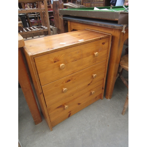 2338 - A modern pine chest of three long drawers