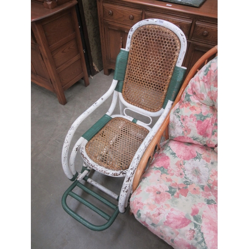 2353 - A mid 20th Century cane and bamboo rocking chair, worn painted work