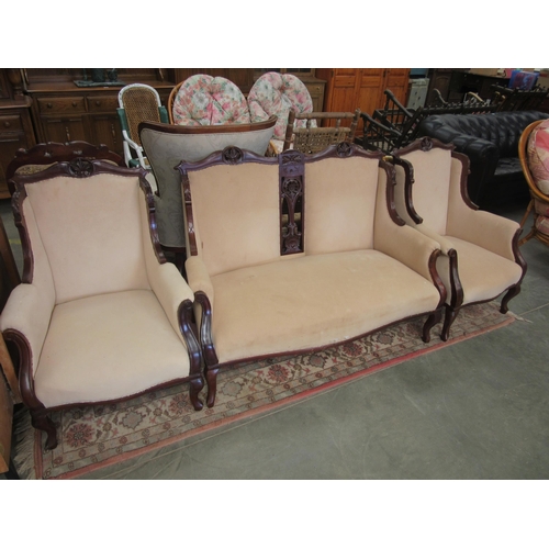 2358 - An Edwardian carved mahogany three piece suite with Calico upholstery