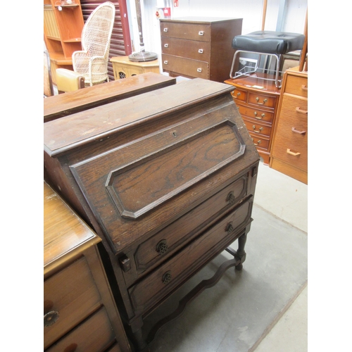 2433 - A walnut chest of three drawers, oak chest of three drawers and a dressing table (3)