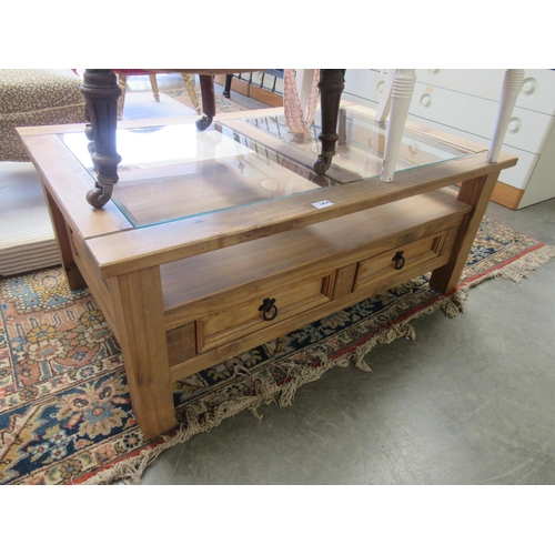 2454 - A pine glass topped coffee table with two drawers