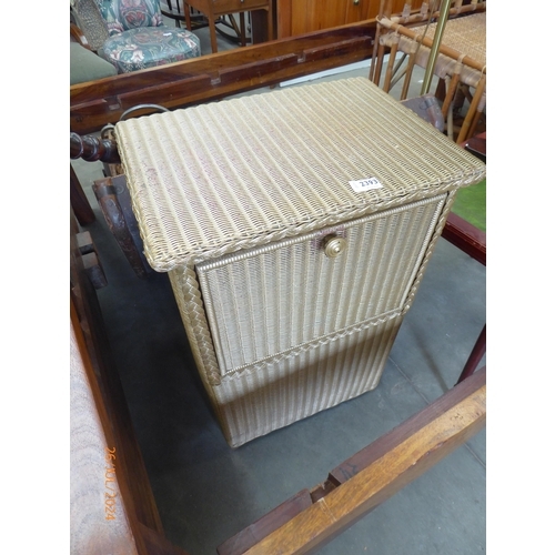 2426 - A 1930's painted Lloyd loom bedside cabinet, linen bin