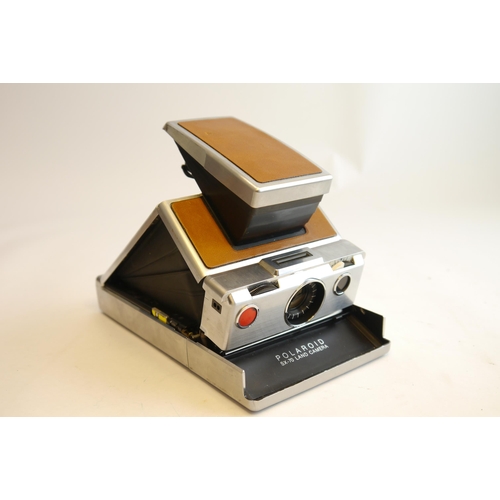 7033 - A Polaroid SX-70 SX70 Land Instant Film Folding Brown Camera & Case. And a Polaroid image 2