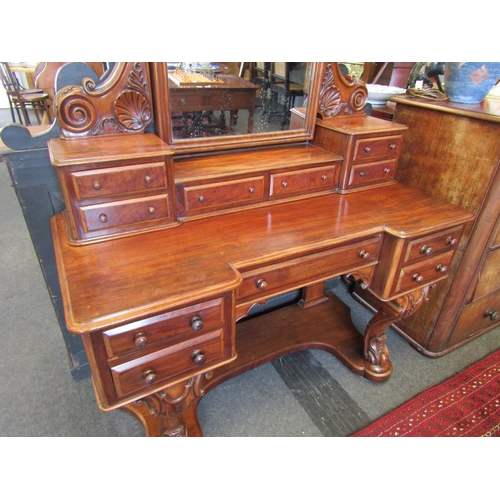 1144 - A Victorian mahogany dressing table, breakfront with scroll supports, eleven drawers, 178cm tall x 1... 