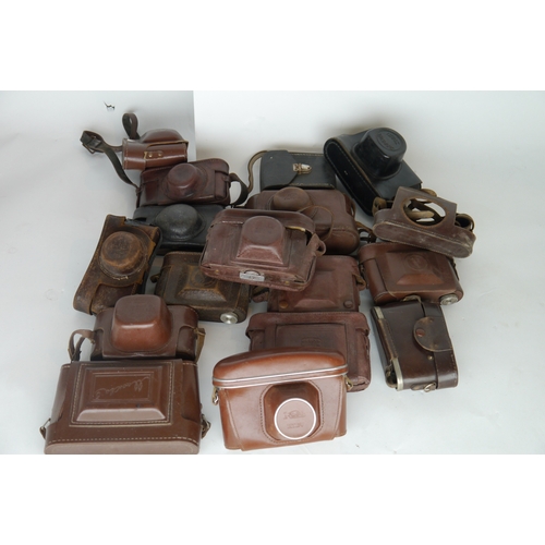 7086 - A box of mixed camera cases including a Leitz Wetzlar Leica Vintage Brown Leather Case