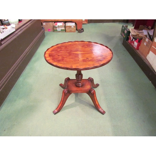 4010 - A George II revival crossbanded yew oval top table with wavy gallery over a ring turned column and p... 