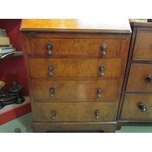 4072 - Circa 1930 a figured walnut writing bureau the fitted interior over four graduating drawers on brack... 