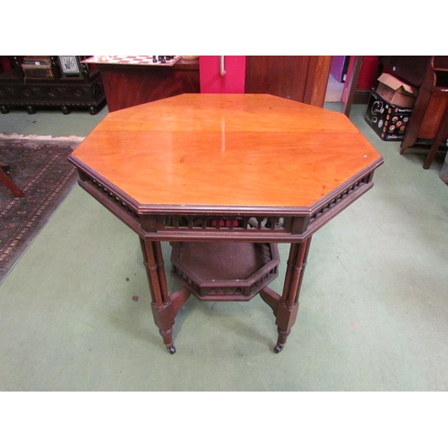 4081 - An Edwardian walnut octagonal top centre table, with under-tier, 74cm tall x 75cm wide