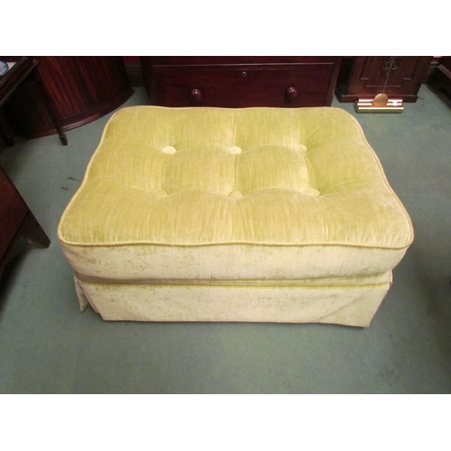 4206 - A lime green upholstered button seat lounge stool on castors, 40cm tall x 82cm long x 58cm wide