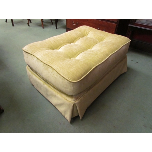 4206 - A lime green upholstered button seat lounge stool on castors, 40cm tall x 82cm long x 58cm wide