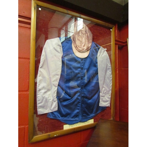4219 - Framed horse racing silks bearing label 