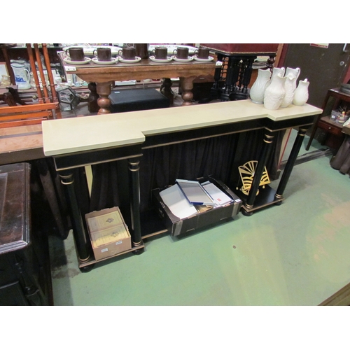 4231 - An Empire style ebonised and gilded breakfront console table, the marble style top over turned pilla... 