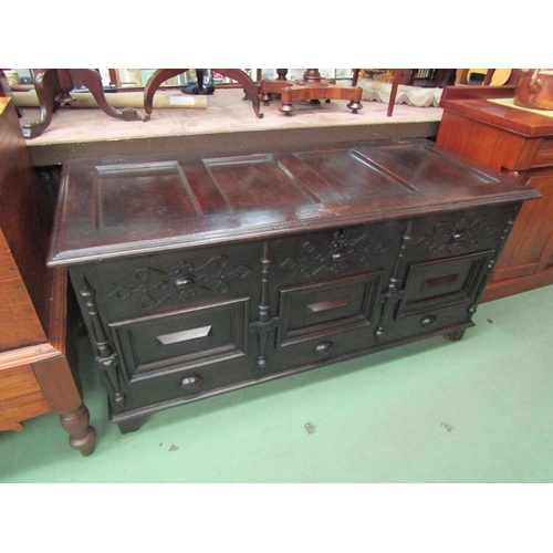 4233 - A 17th Century pegged oak four panelled lid coffer with moulded front decoration over stile feet, 69... 