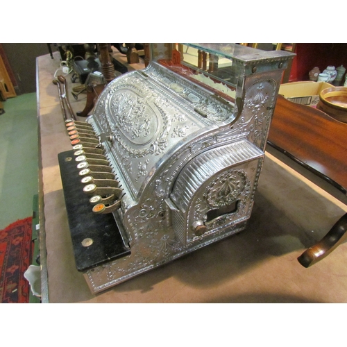 4239 - An NCR cash register; model 346, serial No. 796099, made in 1909.  Nickel plated case, Dolphin patte... 
