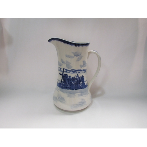 4292 - An empire ware blue and white wash jug depicting Dutch windmill scene, 29.9cm tall