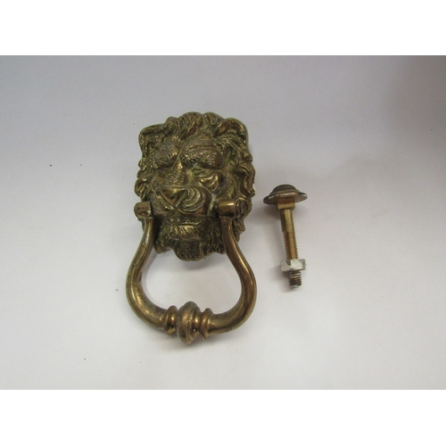 4334 - A 20th Century brass lion mask door knocker