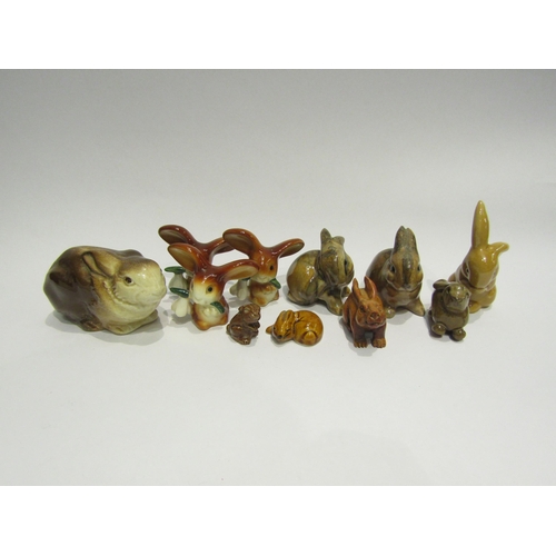 4387 - A selection of rabbits including a Poole pottery recumbent rabbit, pair of rabbits back stamped VE. ... 