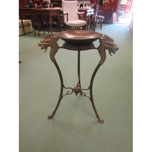 4007 - A cast brass jardinière stand, dragon head decoration, with associated brass tray, 70cm high