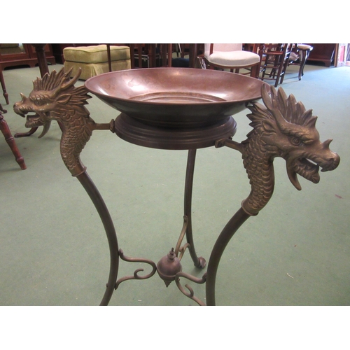 4007 - A cast brass jardinière stand, dragon head decoration, with associated brass tray, 70cm high