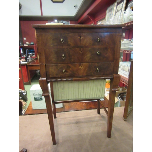 4009 - A George III flame mahogany work/sewing table with crossbanded decoration, the rising top and lift-o... 