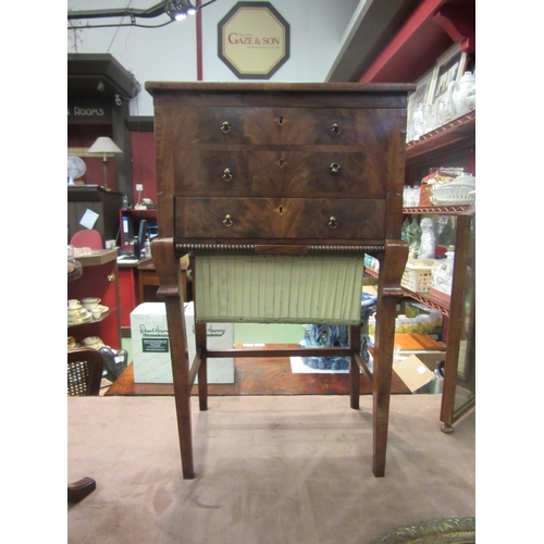 4009 - A George III flame mahogany work/sewing table with crossbanded decoration, the rising top and lift-o... 