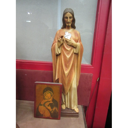 4015 - A resin statue of Jesus Christ, 61cm tall, with a religious icon, 21.5cm x 16cm (2)