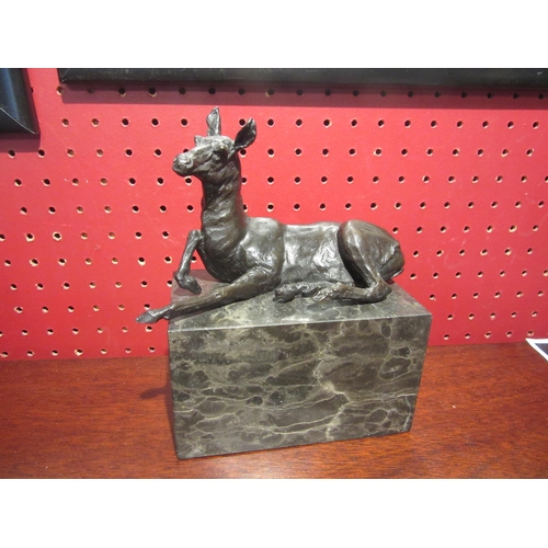 4030 - A bronze figure of a recumbent Llama signed L. Carvin on marble plinth, 13.5cm long, 7cm deep, 15.5c... 