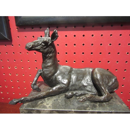 4030 - A bronze figure of a recumbent Llama signed L. Carvin on marble plinth, 13.5cm long, 7cm deep, 15.5c... 