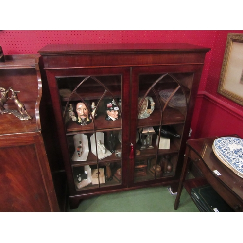 4047 - A 19th Century mahogany bookcase, astragal glazed cathedral/panelled two doors with key, the height ... 