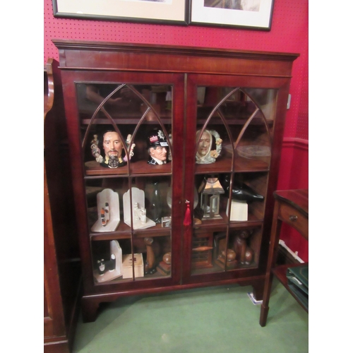 4047 - A 19th Century mahogany bookcase, astragal glazed cathedral/panelled two doors with key, the height ... 